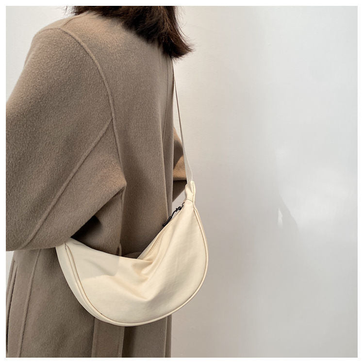 Minimalist Dumpling Messenger Bag