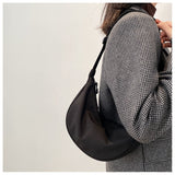 Minimalist Dumpling Messenger Bag